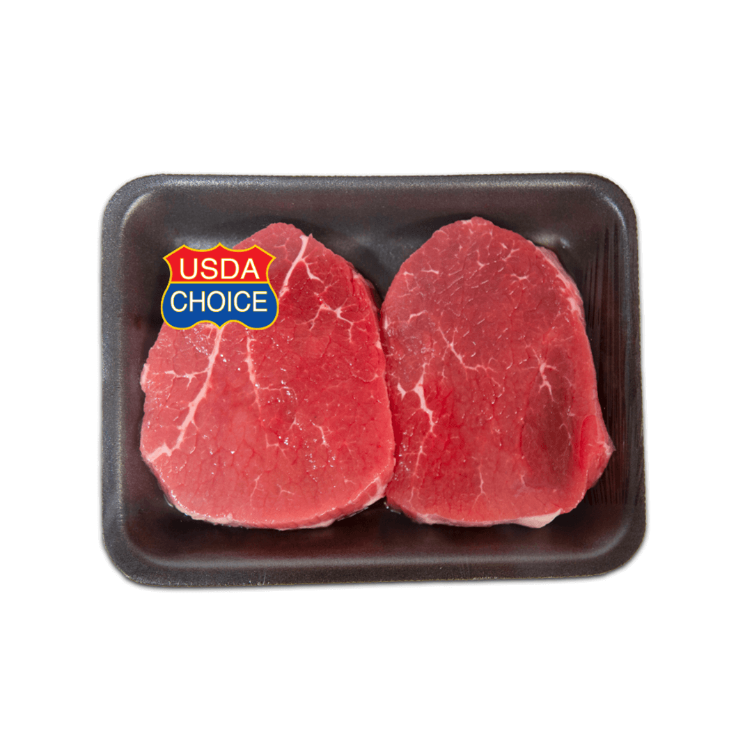 USDA Choice label on two raw beef steaks on a black tray.
