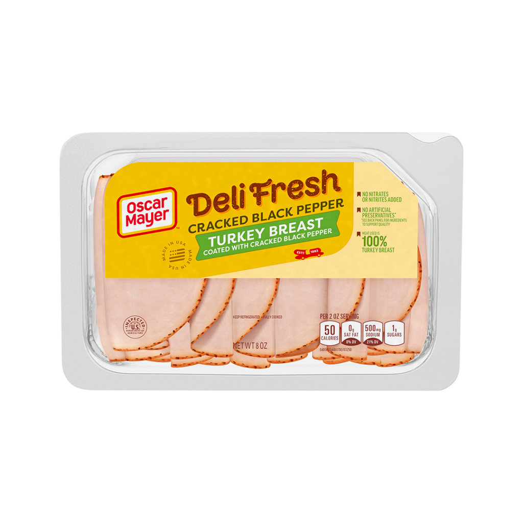 Neatly arranged slices of DeliFresh black pepper turkey in clear package.