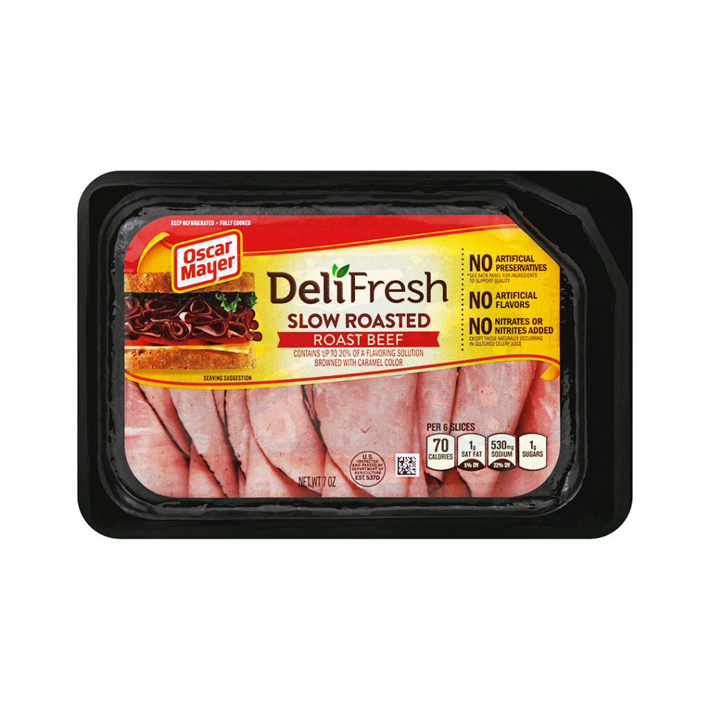 Black tray with red-accented label, filled with thin slices of roast beef.